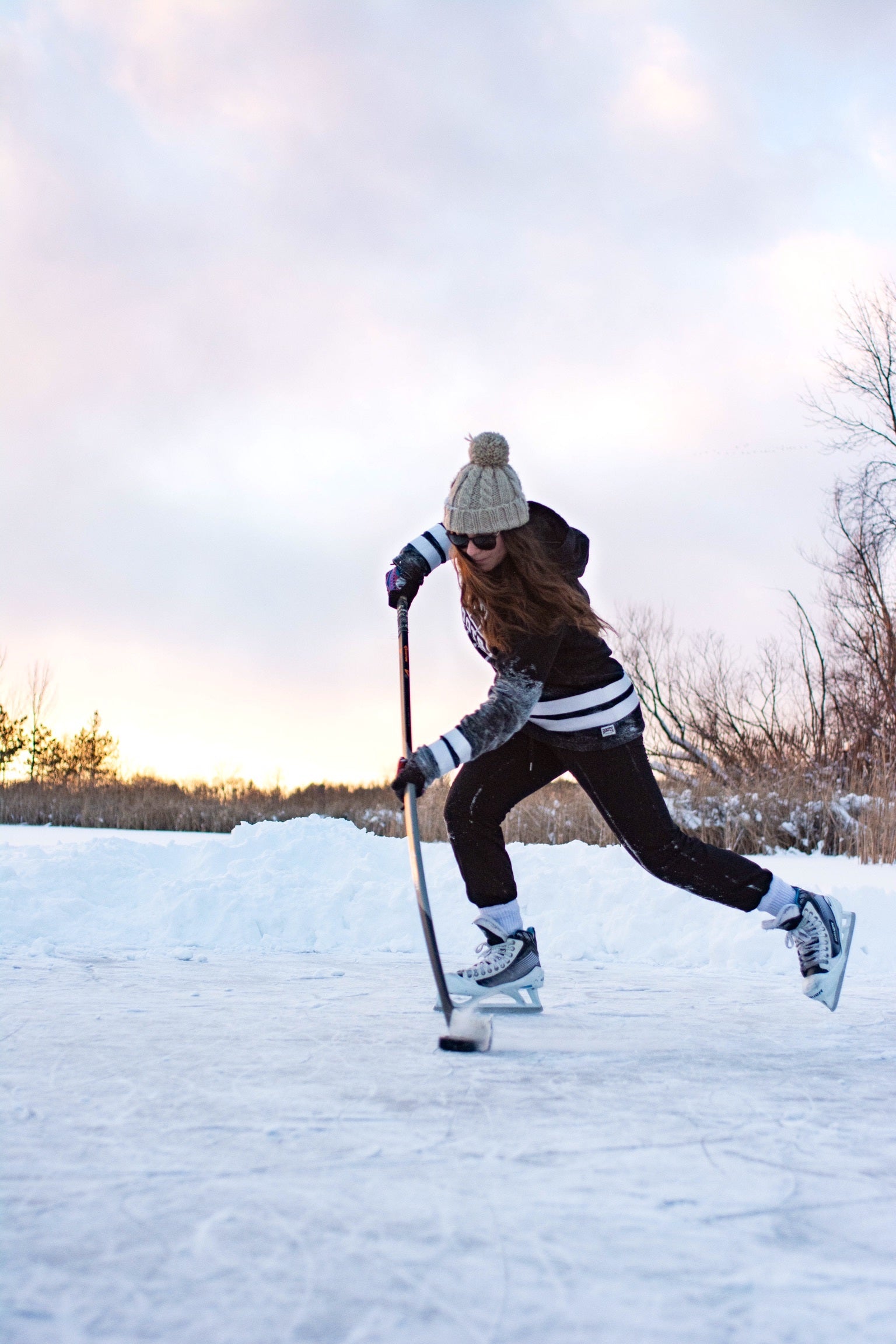 files/female-hockey-player-practicing-stick-handling-on-frozen-lake.jpg